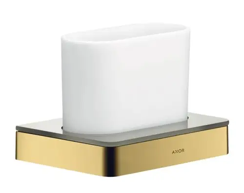 Zahnputzbecher aus weißem Material auf einer rechteckigen Basis mit goldenem Rand, gekennzeichnet mit der Marke AXOR.